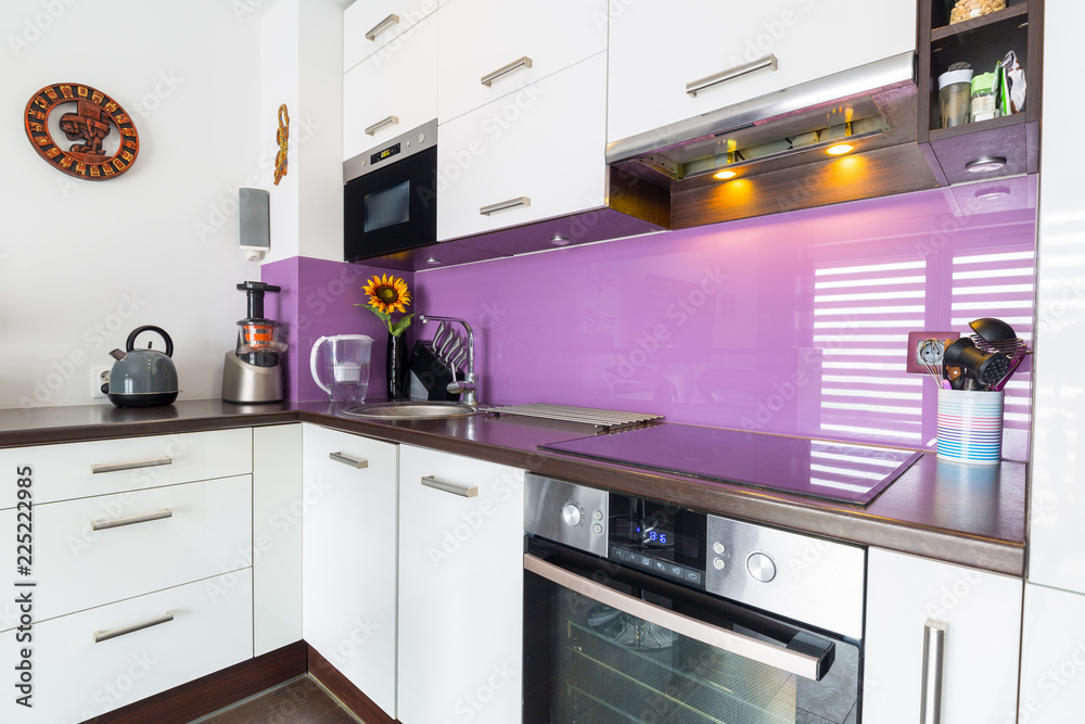 Modern white and purple kitchen interior Modern white and purple kitchen interior