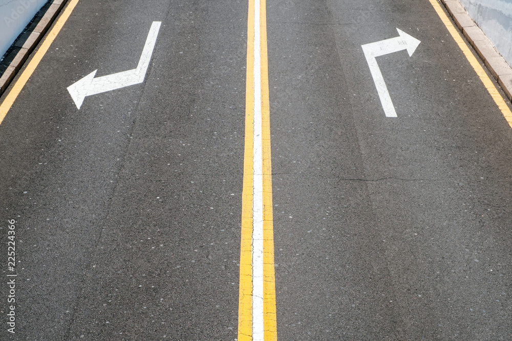 left / right, direction arrows on asphalt road left / right, direction arrows on asphalt road