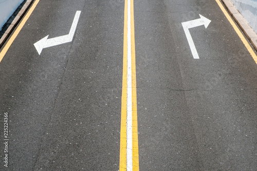 left / right, direction arrows on asphalt road © hanohiki