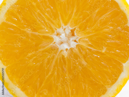 Close-up of half of juicy orange sliced. Healthy and colorful food.