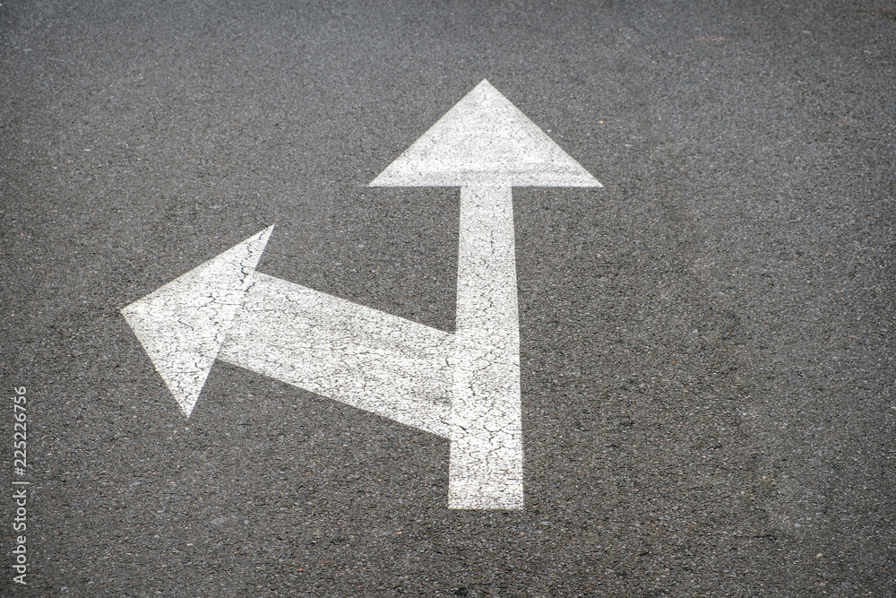 white arrows on asphalt road - street arrow