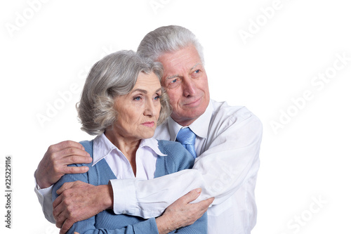 Portrait of senior couple posing on white background