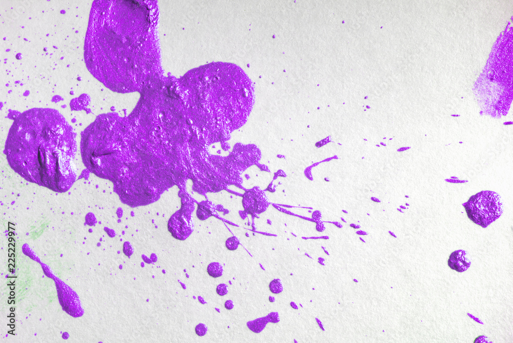 purple watercolor stain spray a drop of paint. on white watercolor textured paper