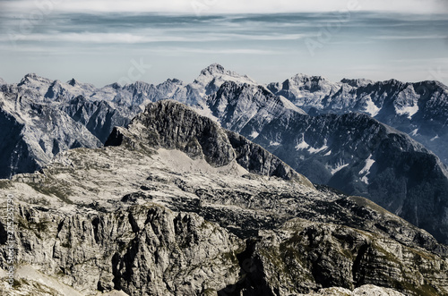 Creative dramatic mountain landscape with high peaks and sharp rocks