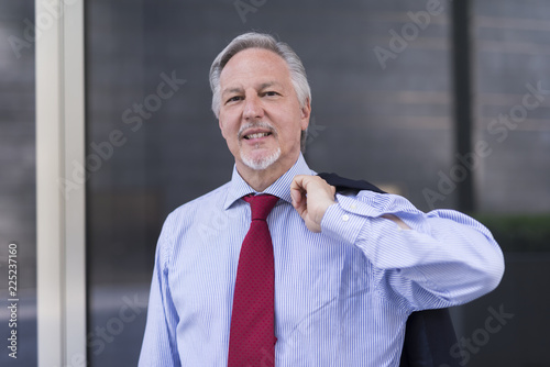Businessman in front of his office