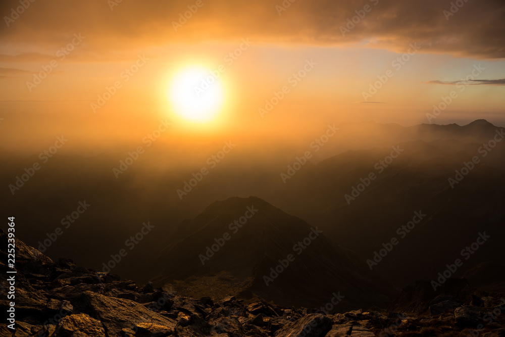 Naklejka premium Sunrise on a mountain peak