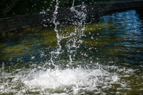 transparent falling water vertical flows, close up