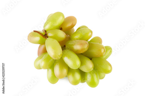 A glass of white wine with a bunch of green grapes on a white background. Alcoholic beverages.