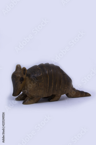wood armadillo in a white background 