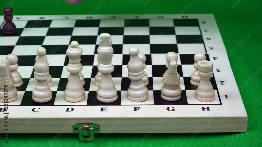 the opponent places a number of black figures on a chessboard. the opponent places a number of black figures on a chessboard.