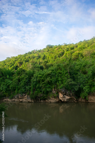 mountain slope on jungle river 