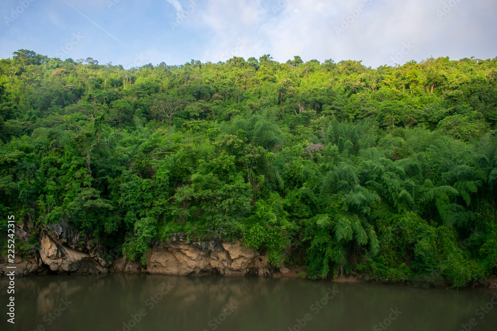 mountain slope on jungle river mountain slope on jungle river