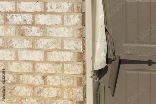 Canvas Print GARAGE ACCIDENT - Garage door damaged in car accident