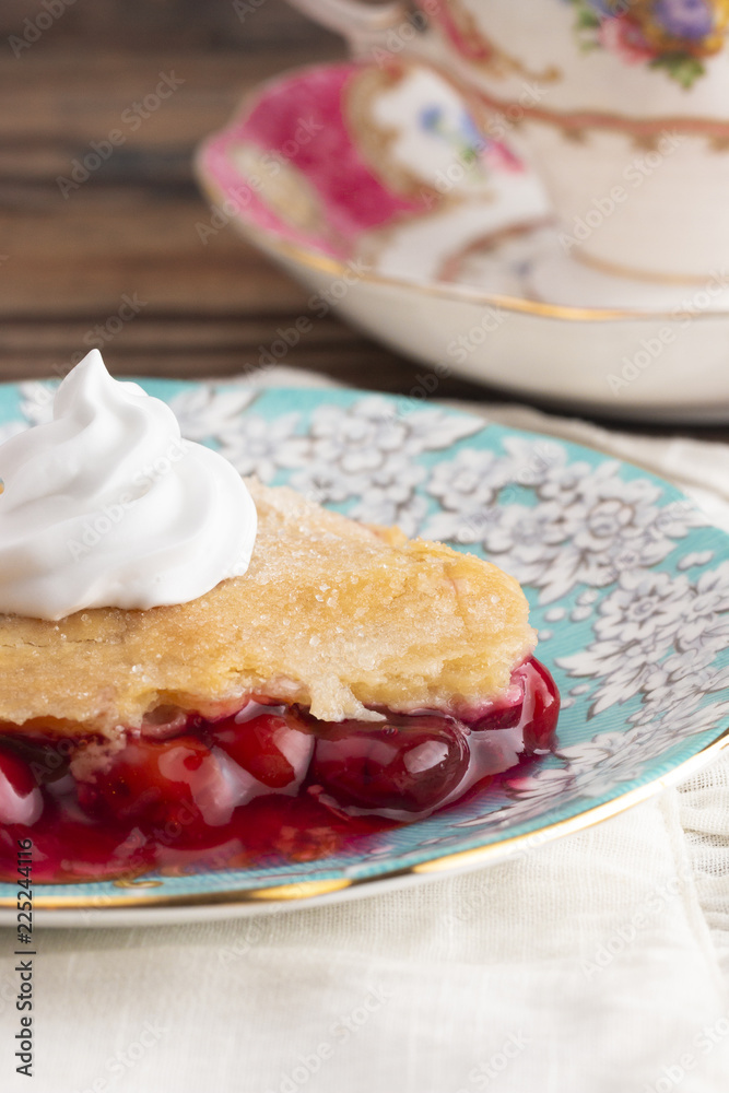 Slice of Homemade Cherry Cobbler on a Blue Antique Saucer Slice of Homemade Cherry Cobbler on a Blue Antique Saucer