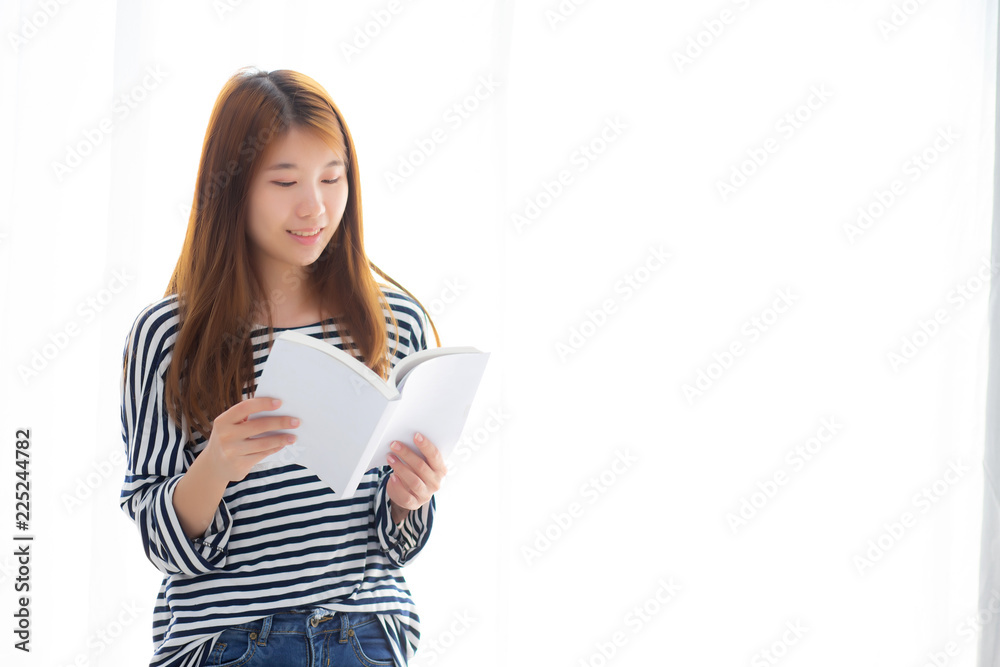 Beautiful of portrait young asian woman relax standing reading book on bedroom at home, girl study literature, education and lifestyle concept. Beautiful of portrait young asian woman relax standing reading book on bedroom at home, girl study literature, education and lifestyle concept.
