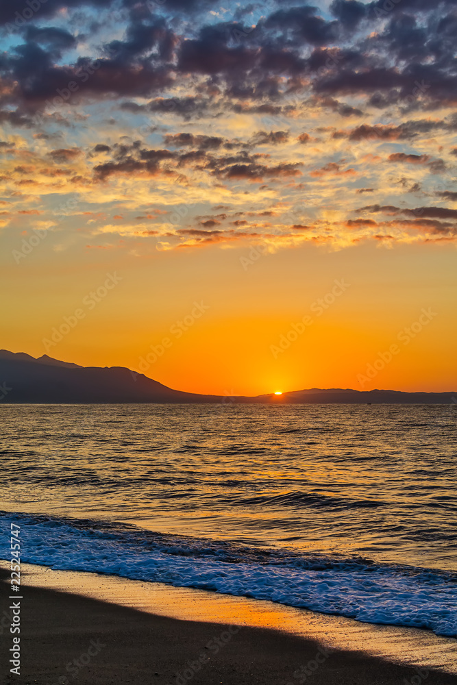 Fototapeta premium Early morning , dramatic sunrise over sea and mountain. Photographed in Asprovalta, Greece.