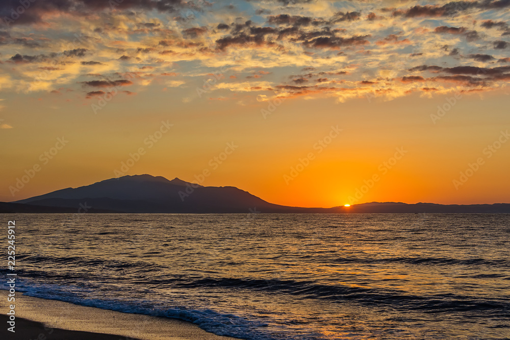 Naklejka premium Early morning , dramatic sunrise over sea and mountain. Photographed in Asprovalta, Greece.