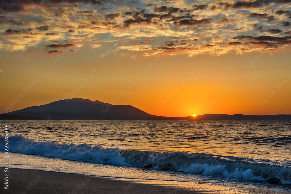 Fototapeta premium Early morning , dramatic sunrise over sea and mountain. Photographed in Asprovalta, Greece.