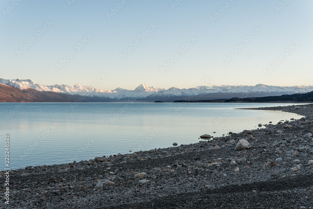 Mount Cook and Lake Pukaki with pebble beach in foreground Mount Cook and Lake Pukaki with pebble beach in foreground