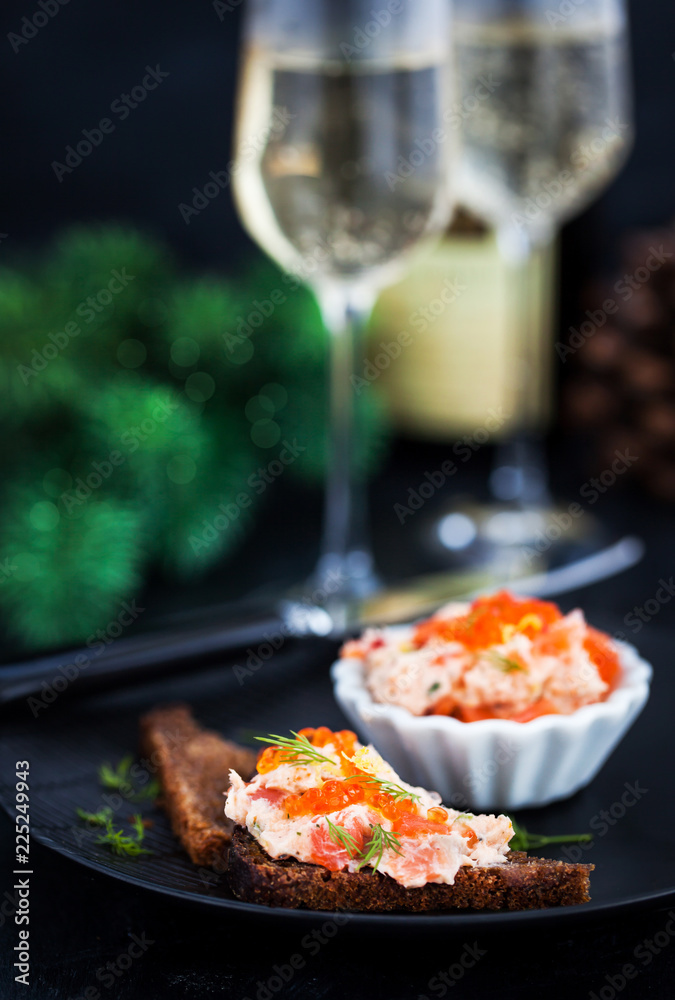 Salmon pate with red caviar served with sliced bread Salmon pate with red caviar served with sliced bread