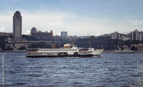 View of traditional public ferry boat on Bosphorus and the European side of Istanbul. © theendup