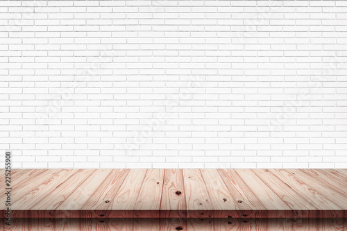 Empty top of wood table with white brick wall texture background.