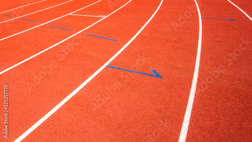 red running track on athletic stadium background texture © suphaporn