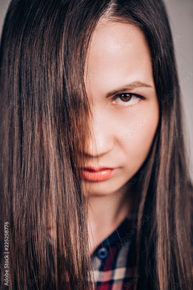 Closeup portrait of a beautiful woman, face covered with hair Closeup portrait of a beautiful woman, face covered with hair