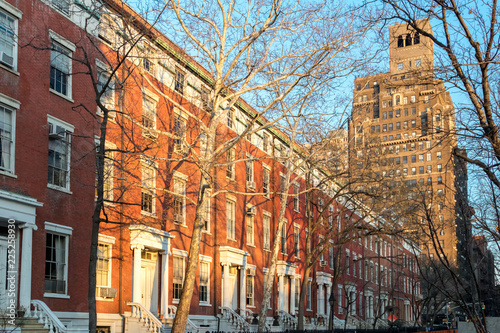 Afternoon sunlight shines on the historic buildings along Washington Square Park in Manhattan, New York City