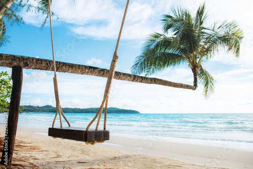 Swing on a tree at sea.