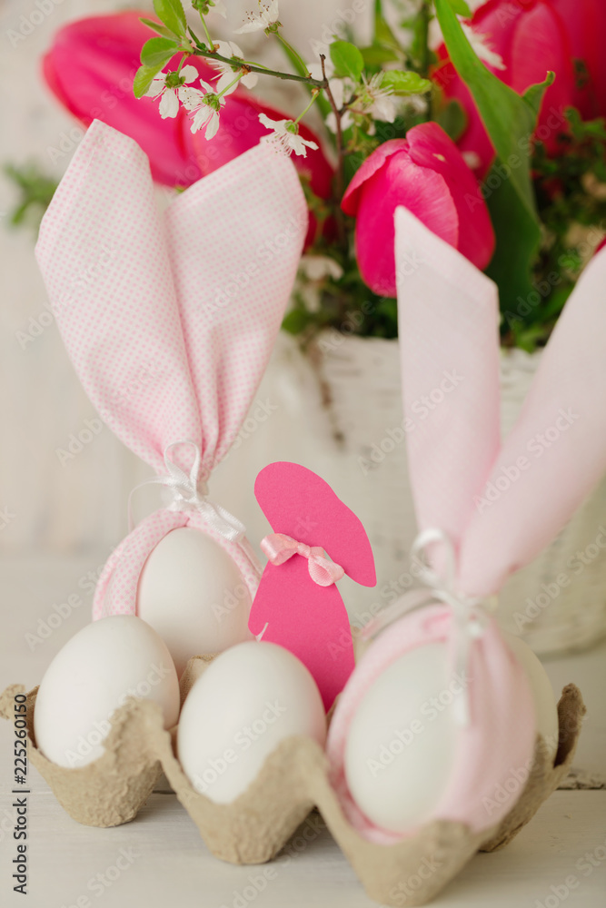 Happy easter. Decor of Easter eggs - napkins in the form of ears of Easter rabbits. Happy easter. Decor of Easter eggs - napkins in the form of ears of Easter rabbits.
