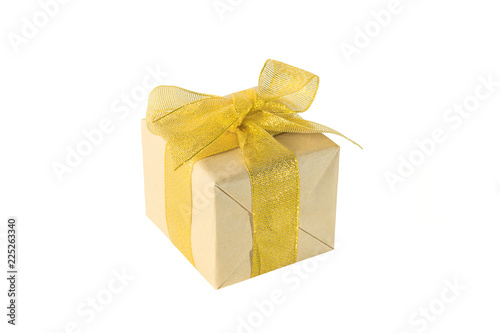 Present or gift box in a craft paper with gold ribbon bow © Natalia Samorodskaia