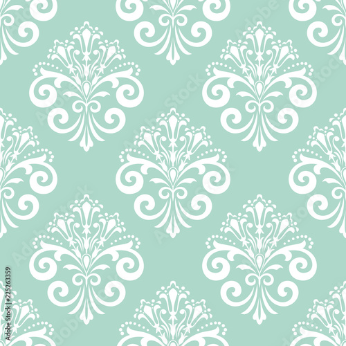 Wallpaper in the style of Baroque. Seamless vector background. White and blue floral ornament. Graphic pattern for fabric, wallpaper, packaging. Ornate Damask flower ornament