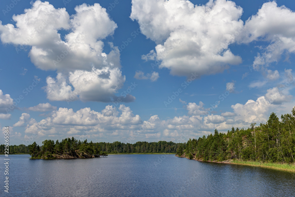 cumulus clouds over the summer lake