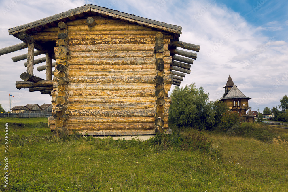 A long chopped log house on the lawn