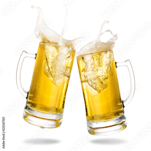 Cheers cold beer with splash out of mug isolated on white background.