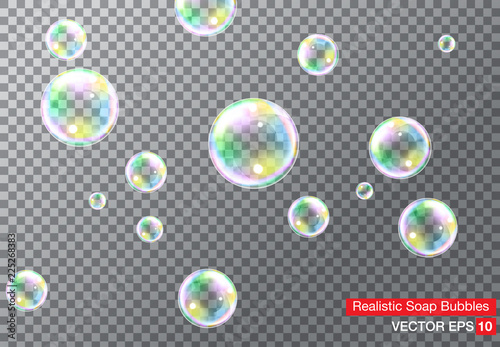 Set of realistic transparent colorful soap bubbles with rainbow reflection isolated on checkered background