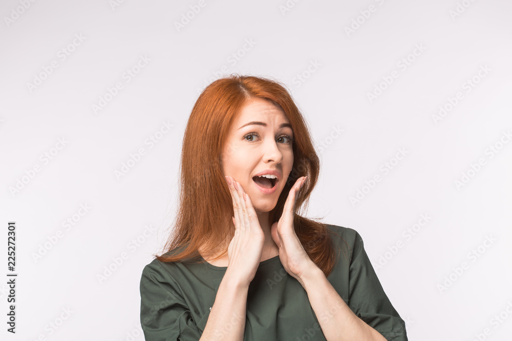 Excited happy red-haired woman on white background Excited happy red-haired woman on white background