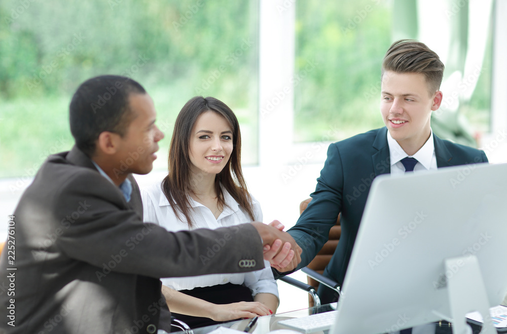 handshake international business partners on a Desk handshake international business partners on a Desk