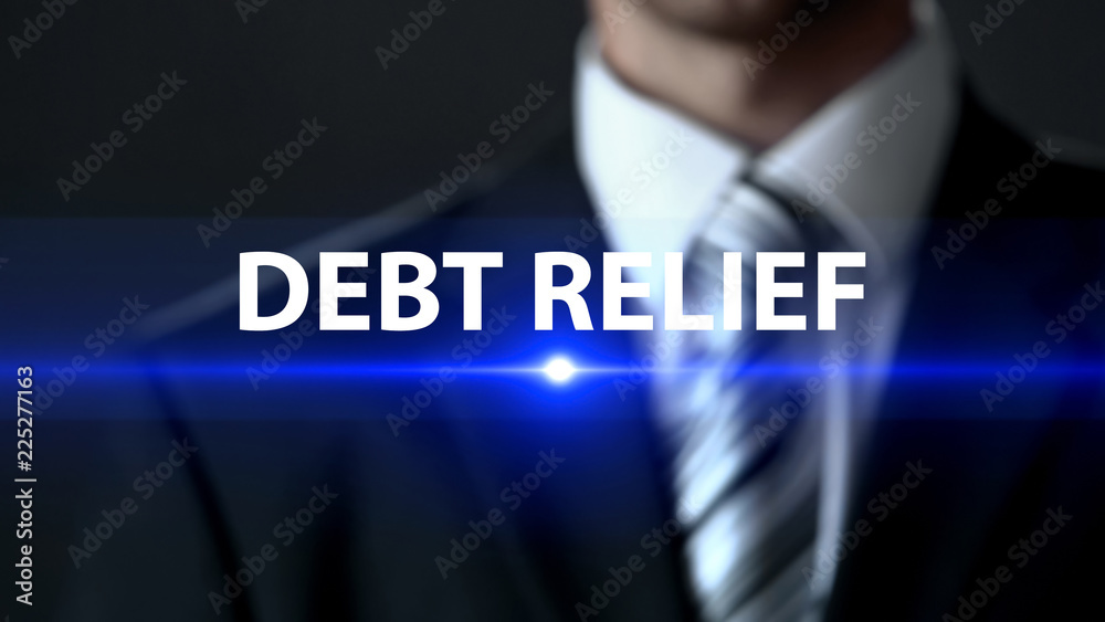 Debt relief, businessman standing in front of screen, financial assistance Debt relief, businessman standing in front of screen, financial assistance