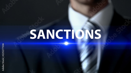 Sanctions, businessman in front of screen, danger prevention, prohibition