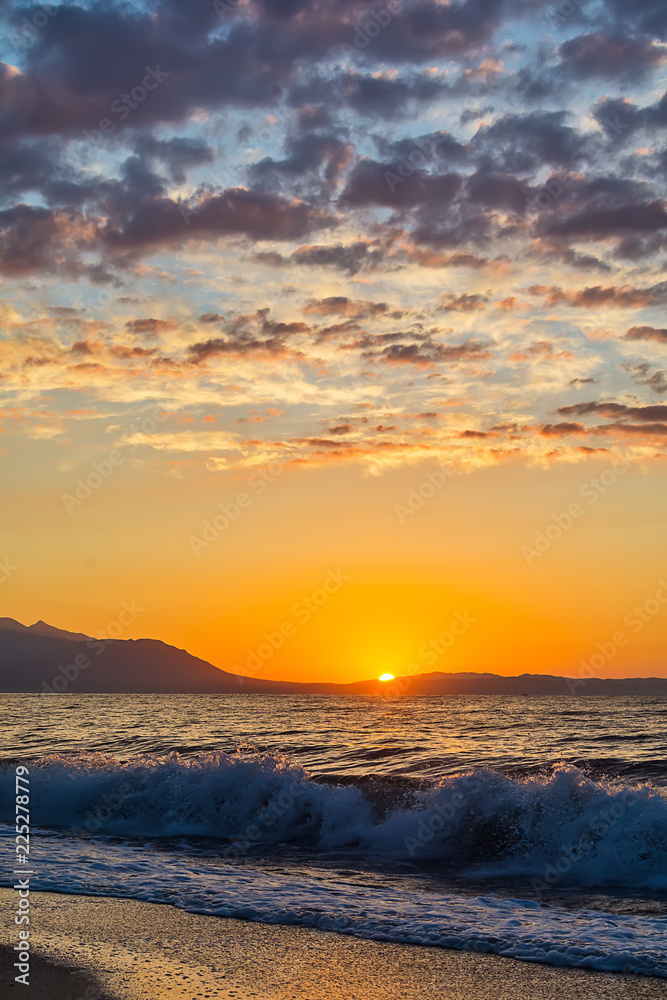 Early morning , dramatic sunrise over sea and mountain. Photographed in Asprovalta, Greece.