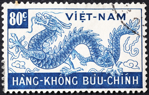 Dragon on old vietnamese postage stamp photo