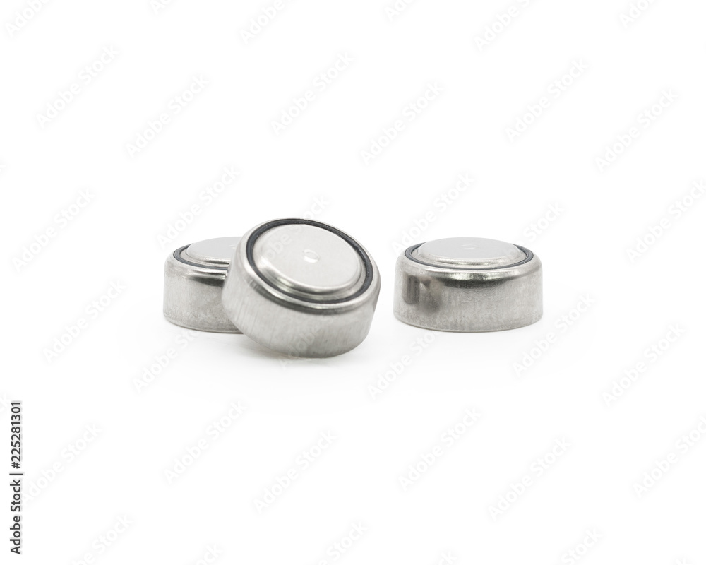 Button cell on isolated background. Small watch lithium battery ( Clipping path or cutout object for montage ) Button cell on isolated background. Small watch lithium battery ( Clipping path or cutout object for montage )