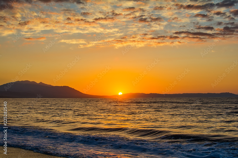 Early morning , dramatic sunrise over sea and mountain. Photographed in Asprovalta, Greece.