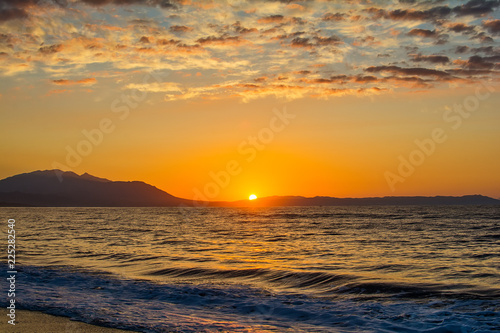Early morning   dramatic sunrise over sea and mountain. Photographed in Asprovalta  Greece.