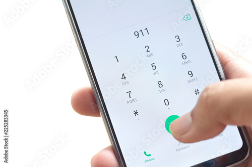 Canvas-taulu Emergency and urgency, dialing 911 on smartphone screen isolated on white backgr