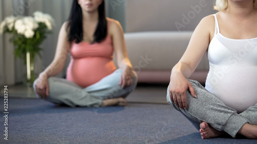 Prenatal yoga class for pregnant women to stay in shape and tone their muscles photo