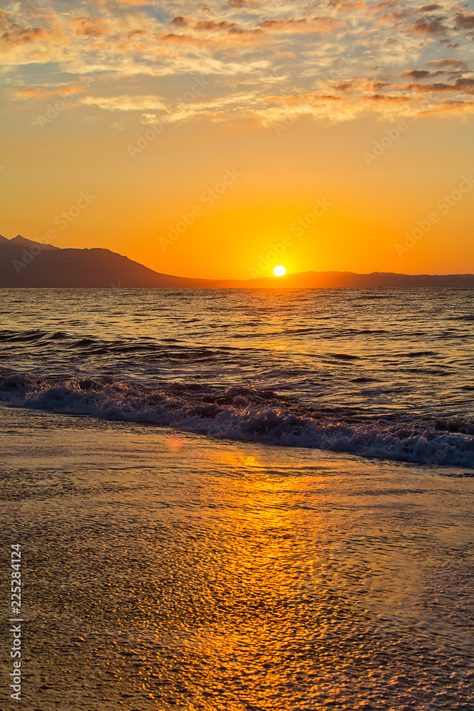 Naklejka premium Early morning , dramatic sunrise over sea and mountain. Photographed in Asprovalta, Greece.
