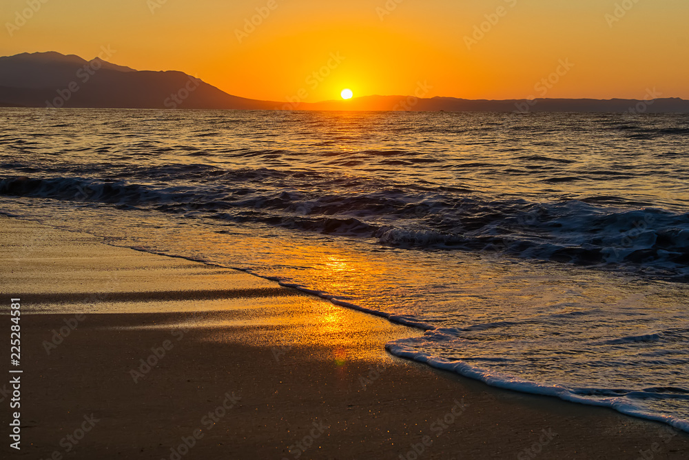 Naklejka premium Early morning , dramatic sunrise over sea and mountain. Photographed in Asprovalta, Greece.